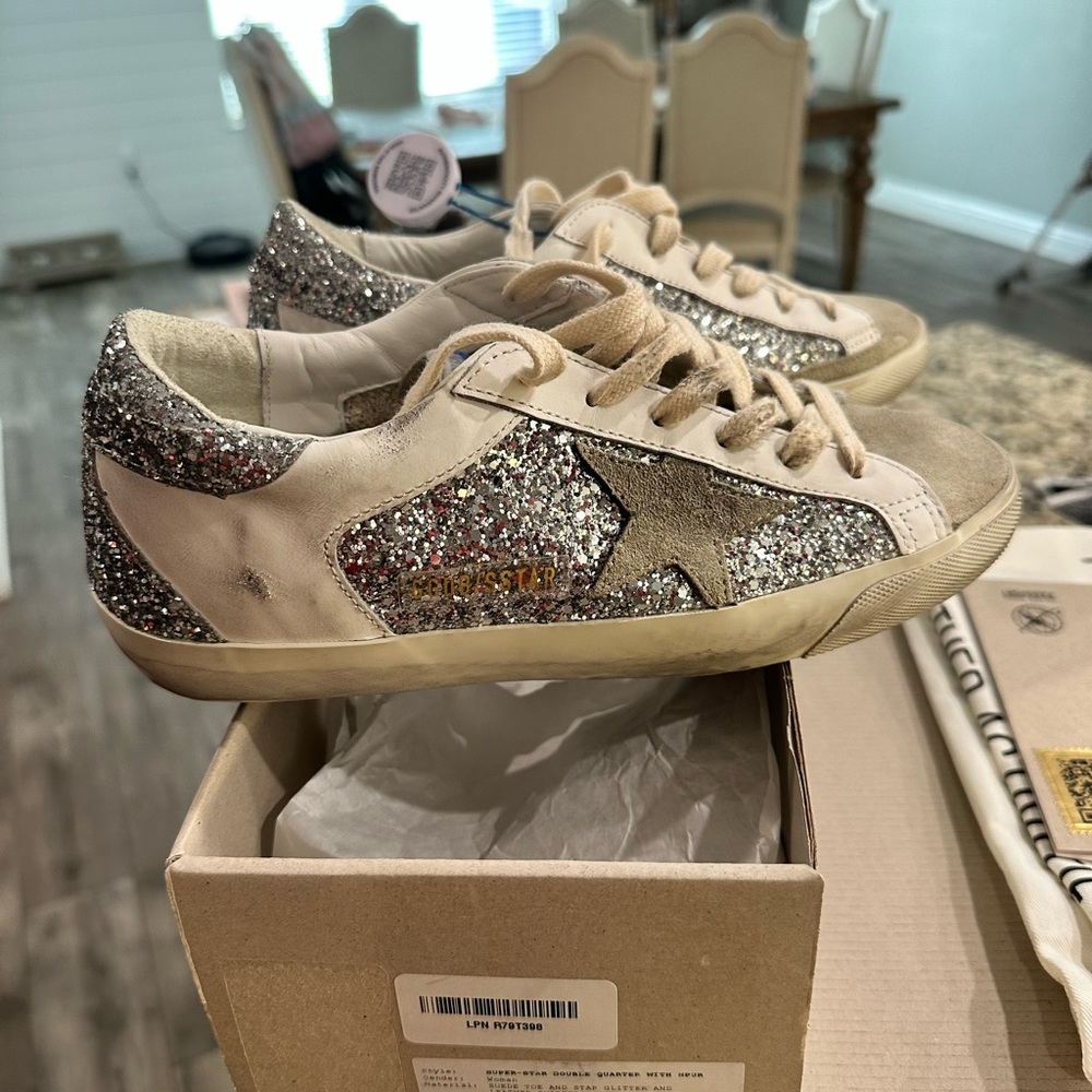 Golden Goose size 38. New in box. Only tried on once and were too big.